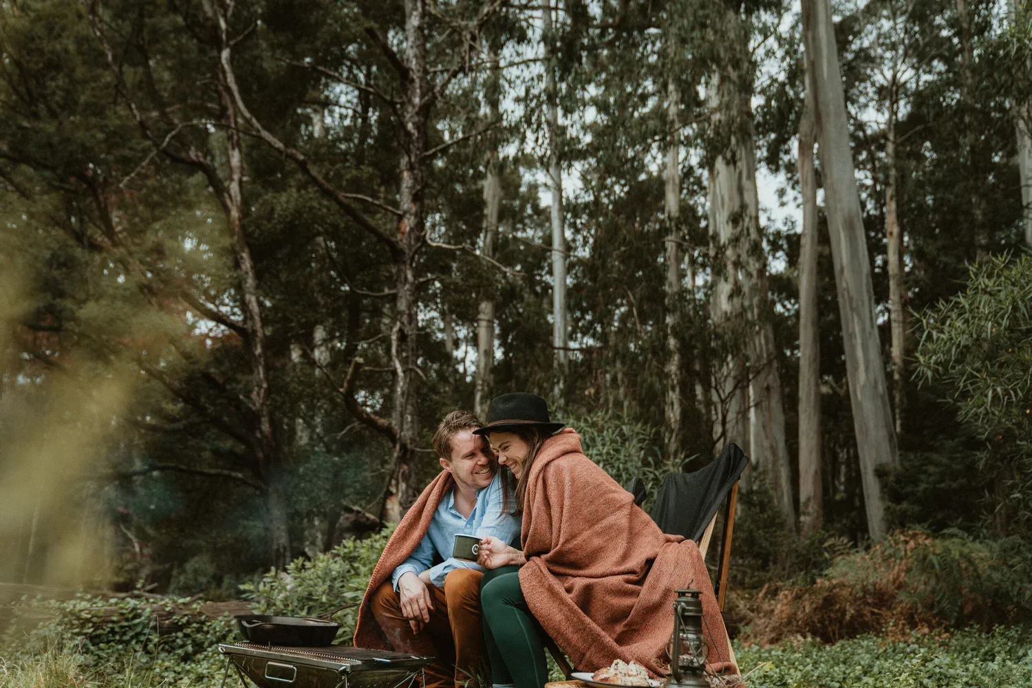 A blanket in use within the bushland setting.