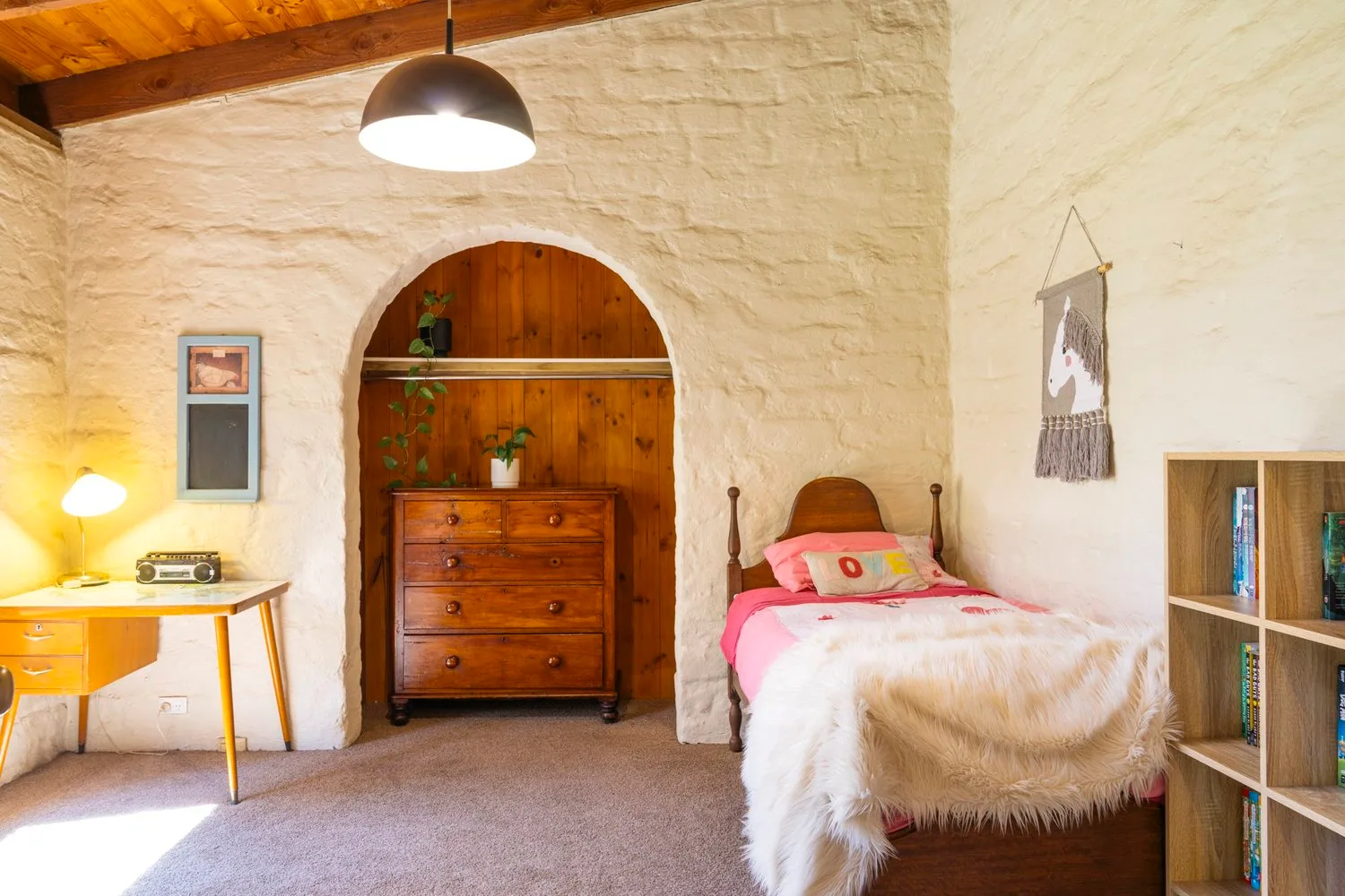 An arched doorway and textured walls in the Avon Road house.