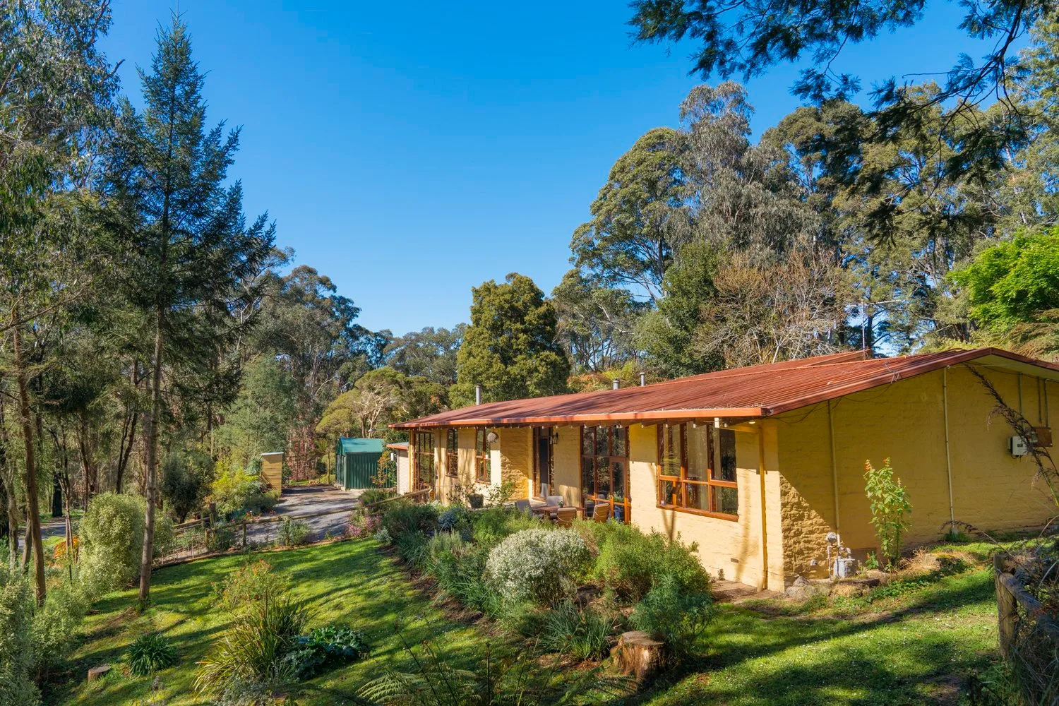 The long roofline and garden around the house.