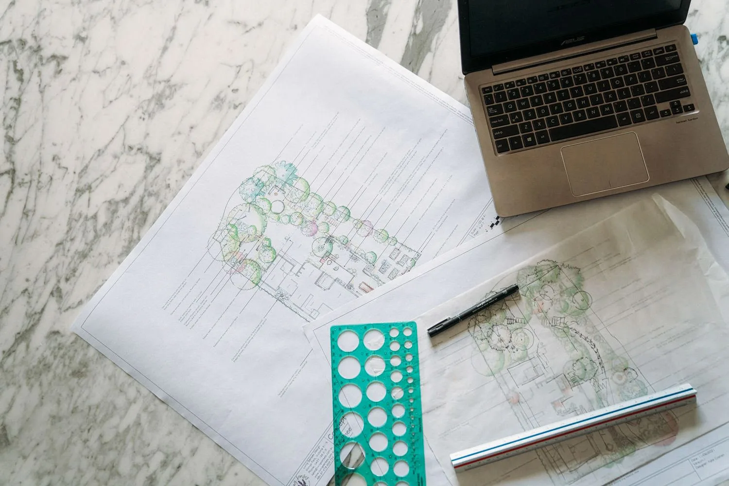 A garden drawing and colour samples on a table.